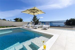 Elegant beachfront villa with pool in Omis. Sleeps 8-10